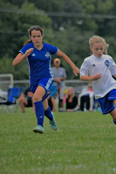 Three Girls Playing Soccer